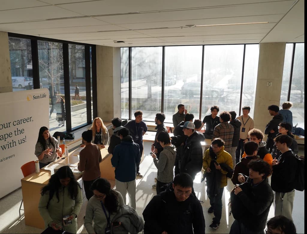 Hackers networking with sponsors at GenAI Genesis