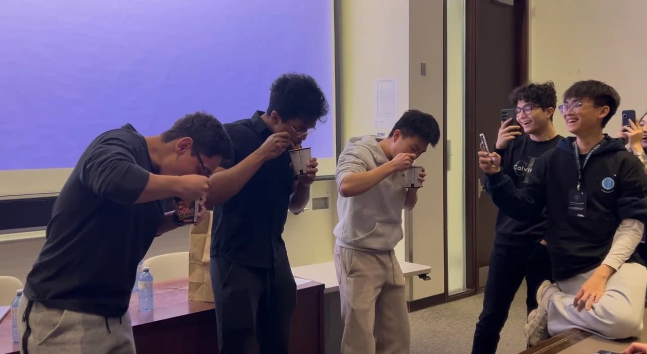 Hackers competing in a spicy ramen challenge